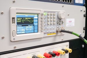 An electronic test panel displays values describing the condition of an excitation system